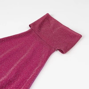 Close-up of fuchsia halter neckline featuring sparkling metallic fabric and feather trim