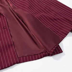 Detail of burgundy pinstripe blazer showing high-quality inner lining and neat stitching