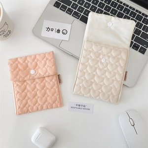 Quilted heart pattern storage pouch with snap button for feminine care items and cables