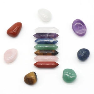 7-piece hexagonal crystal points and 7-piece tumbled stone set on white background