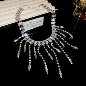 Macro shot of silver tiered fringe necklace with marquise crystal pendants and rhinestones