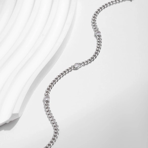 Elegant s925 sterling silver chain bracelet with round moissanite stones on white background