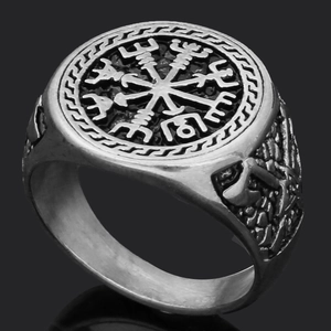 Detailed macro view of silver Viking Vegvisir compass ring with Norse axe side engravings