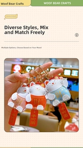 Detail of cartoon Lucky Cat leather keychains with metallic D-ring and red charms