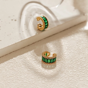 Detail of 18K gold plated ear cuff with emerald green rectangular cubic zirconia stones