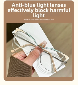Detail of silver cat-eye metal frame glasses with green accents and anti-blue light lenses