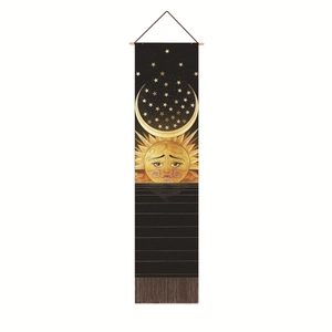 Detail of Nordic moon and sun tapestry with gold celestial patterns and tassels