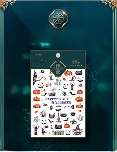 Detail of Halloween nail stickers featuring pumpkins, witches and black cats TS-187