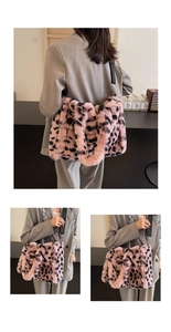 Pink leopard print plush tote bag with black fabric strap and gold hardware accents