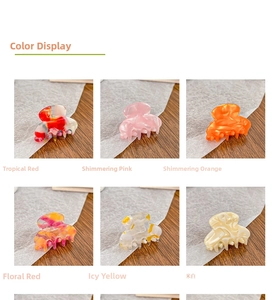 Detailed view of colorful acetate hair clips showing diverse marble and floral textures