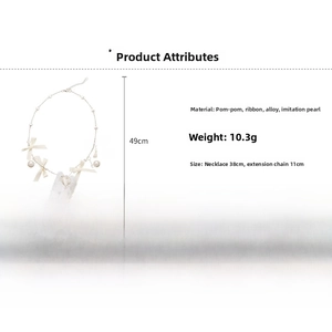 Detailed view of white ribbon bow necklace with fur ball and heart pendant dimensions