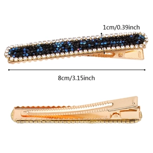 Elegant 8cm gold hair clip with black and blue rhinestones on a white background