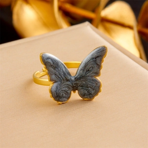 Adjustable golden stainless steel ring featuring a 3D textured butterfly design