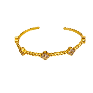 Bracciale a quadrifoglio placcato oro 18k con pavé di zirconi e trama a rilievo