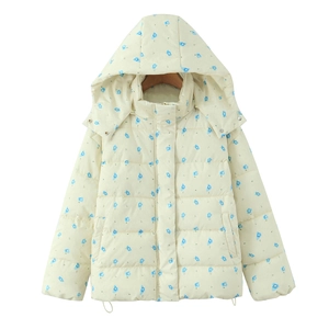 Detailed view of the drawstring hem and blue floral print on a white hooded parka coat