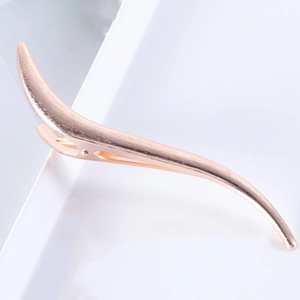 S-shaped brushed metal duckbill hair clip in rose gold finish for elegant hairstyling