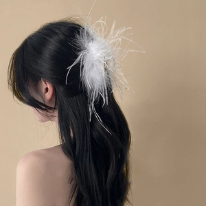 Elegant white ostrich feather hair claw clip for women's sophisticated updo hairstyle
