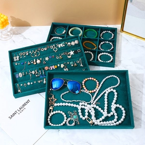 Three-piece set of dark green velvet jewelry trays for necklaces, rings, and earrings