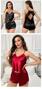 Close-up of women's satin pajama set with floral lace back and backless detail
