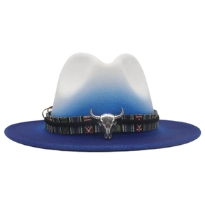 Detail of gradient blue felt cowboy hat featuring ethnic woven band and silver bull head