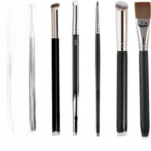 Detailed set of professional concealer and mask brushes with matte black handles