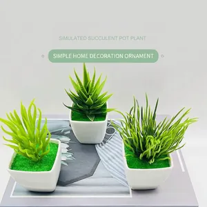 Three artificial succulents in white square pots for modern minimalist office desk decor