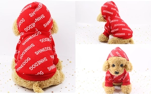 Detailed view of red pet hoodie with SHINEDOG print on soft cotton fabric