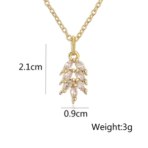 Detailed view of gold leaf pendant necklace with dimensions 2.1x0.9cm and 3g weight