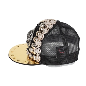 Hip hop baseball cap with gold brim, metallic rivets and skull ornaments on black mesh