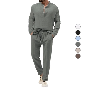 Detail of grey-green cotton linen texture on men long sleeve shirt and trouser set