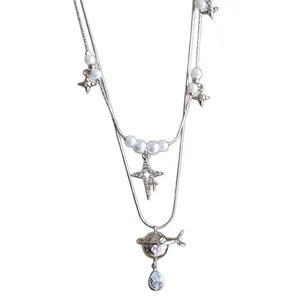 Double-layer pearl necklace with North Star and Saturn pendants and zircon drop charm