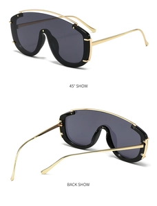 Front and back views of shield sunglasses with dark lenses and gold metal top bar