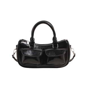 Minimalist black glossy saddle bag with dual front pockets and silver hardware