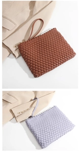 Detailed close-up of brown and lilac woven clutch bags in premium synthetic leather material