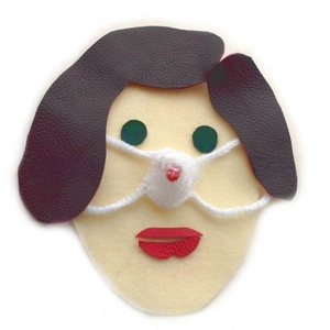 Close-up of a handmade white knitted nose warmer with a red heart and brown leather details