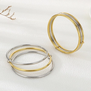 Minimalist 3mm interlocking stainless steel bangles in gold and silver finish