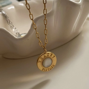 Luxurious gold stainless steel necklace with round white shell pendant and vintage engraving