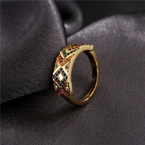 Adjustable gold plated geometric ring with colorful cubic zirconia on grey silk