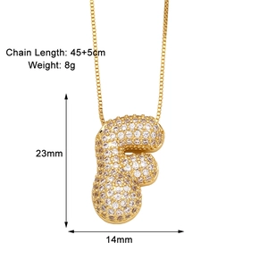 Detail view of gold bubble letter F necklace with zircon stones and size specifications