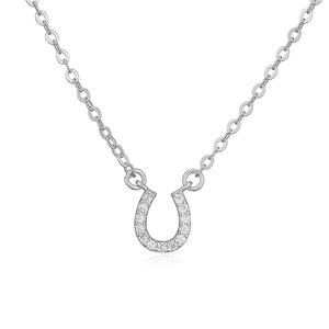 Detailed close-up of a silver horseshoe pendant necklace with pavé set crystals on white