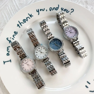 Elegant women's quartz watches with silver metal straps and crystal bezels in four colors