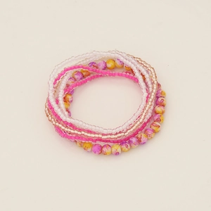 Detail of multi-layered Bohemian seed bead bracelet set with colorful crystal strands