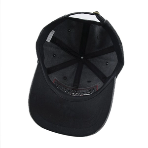 Detailed interior of washed cotton baseball cap showing 100% cotton label and metal buckle