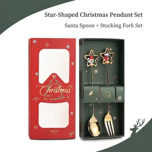 Detailed view of stainless steel Christmas spoons with star charms in a red and green gift box