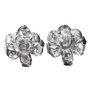 Detailed macro view of silver leaf earrings with unique hammered texture and layered metal petals