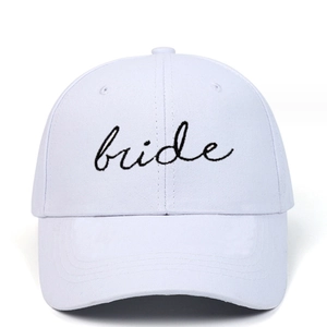 Classic white cotton baseball cap featuring elegant black bride script embroidery