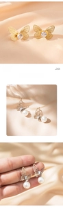 Detail of gold butterfly stud with zircon and silver butterfly pearl earrings set