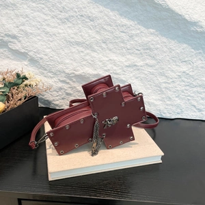 Burgundy gothic cross crossbody bag with skull stud and metal chain fringe detail