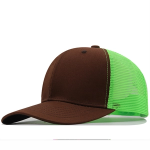 Brown and neon green trucker hat with breathable mesh and curved brim in side view