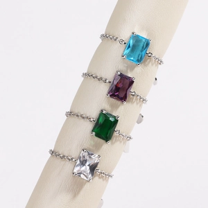 Detailed shot of adjustable soft chain rings with colorful emerald cut zircon stones